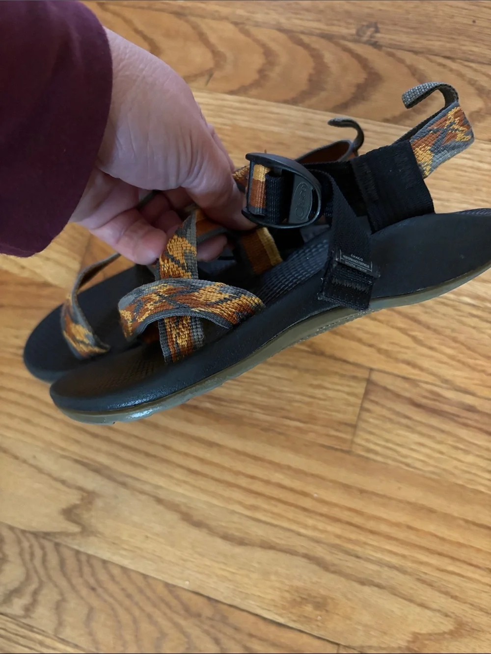 Chaco Black Sandals with Orange and Tan Patterned Straps